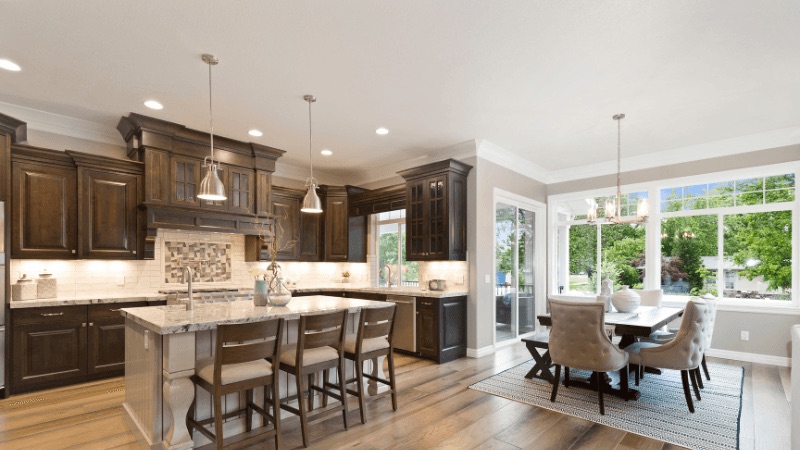 Gourmet kitchen remodel with dark wood cabinetry and large island in Chadds Ford, PA