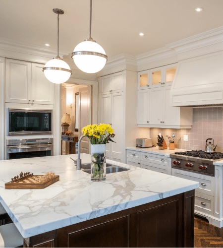 Modern kitchen remodel with white cabinets and marble countertops in Kennett Square, PA